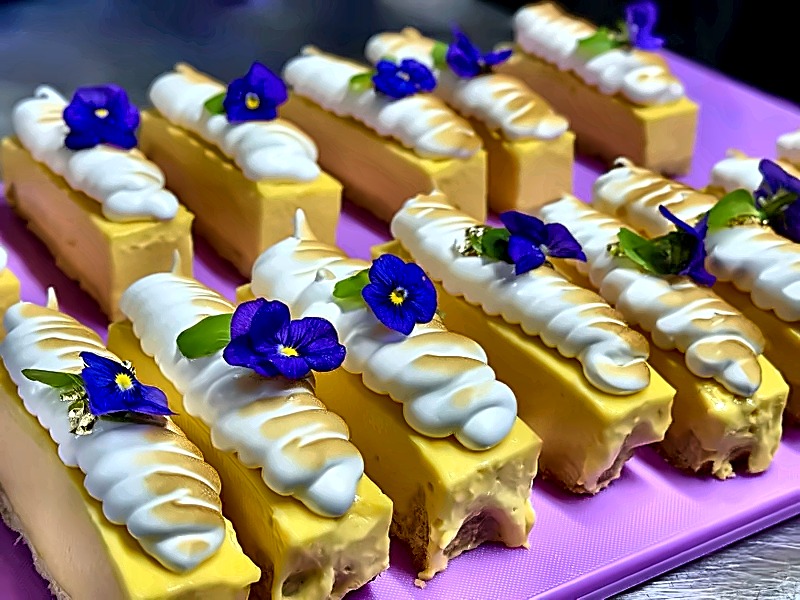 Lemon meringue slices topped with edible violas