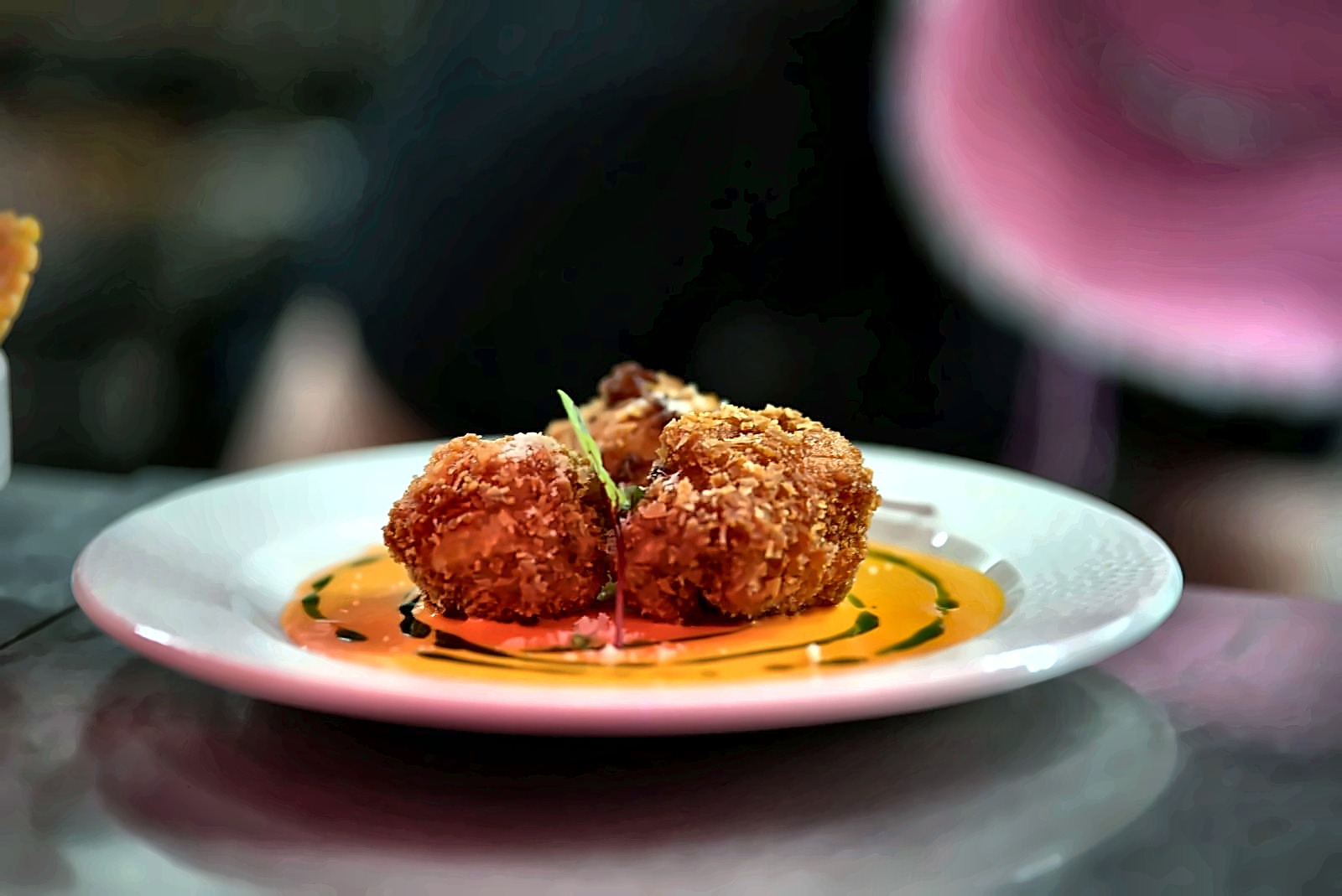 Crispy arancini with romesco and herb oil