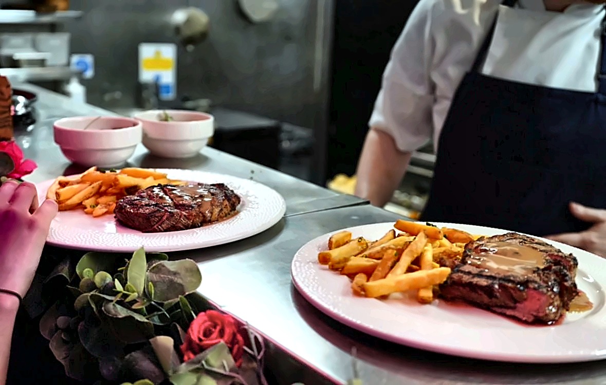 Chargrilled steaks with skinny fries on the pass