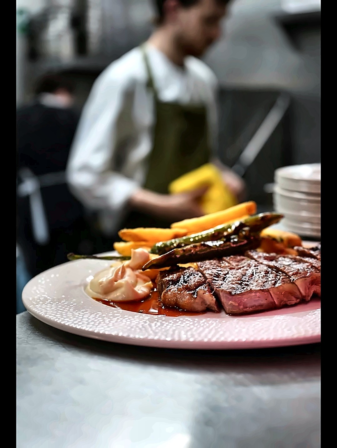 Ribeye steak with fries and grilled green chilli